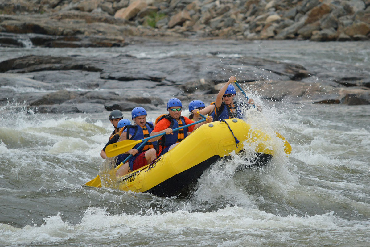A group of rafters enjoy a float trip in Glacier National Park