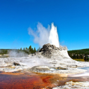 A geyser erupts near Old Faithful Lodge in Yellowstone National Park