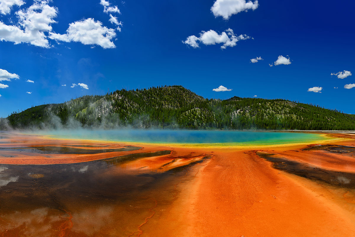 Vibrant red and blue collars of a geyser pool in Yellowstone National Park