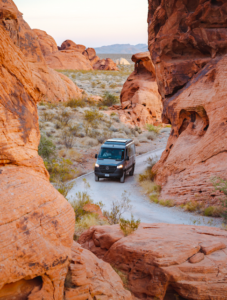 Moterra campervan driving a winding road through a canyon