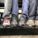 Legs with Hiking Boots Resting on Side of Moterra Sprinter Campervan Rental