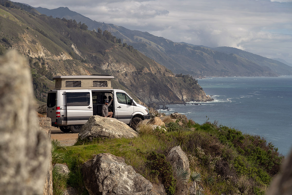 Man Viewing Ocean from California Coast with a Moterra San Francisco Campervan Rental