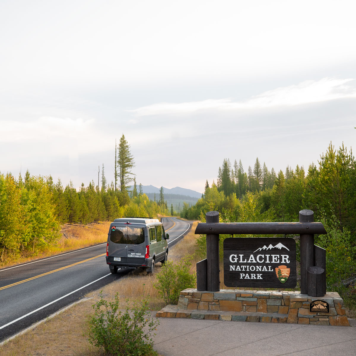 Moterra Montana Campervan Rental Parked at Entrance to Glacier National Park