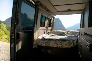 Mountain Views from Bed Inside Moterra Campervan Rental in Glacier National Park