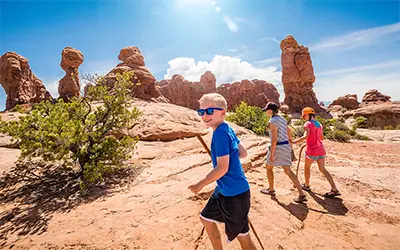 Young Family Hiking in Arches National Park, Utah