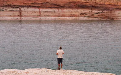 Person Fishing at Lake Powell, Utah-Arizona
