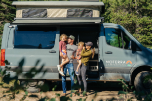 photo of family smiling while enjoying a trip in a moterra van