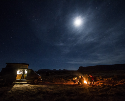 Moterra van camping under a full moon