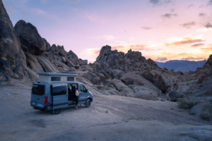 a woman watching sunset in the alabama hills near the Eastern Sierra