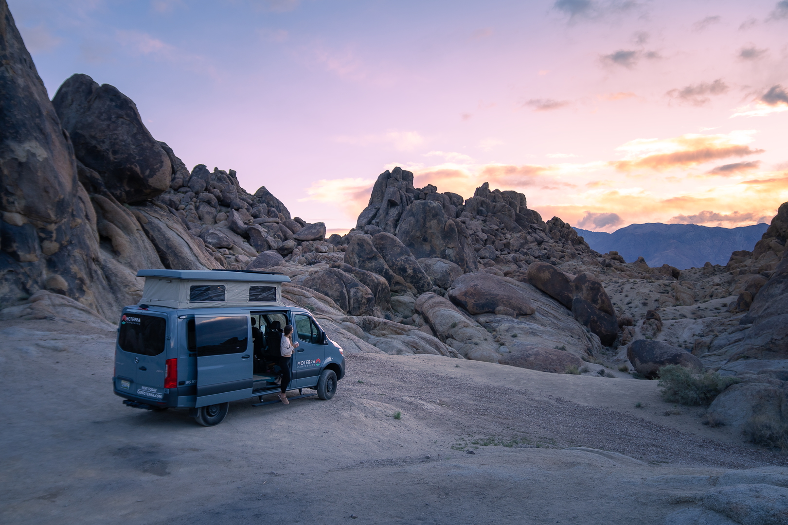 a woman watching sunset in the alabama hills near the Eastern Sierra